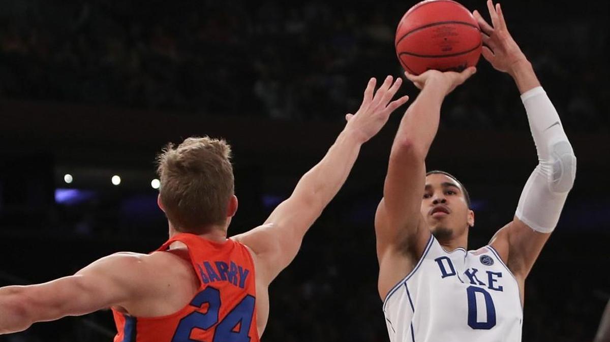 Duke’s Jayson Tatum, right, shoots a jumper against Florida on Dec. 6. Tatum Tuesday was named national freshman of the week by the United States Basketball Writer’s Association.