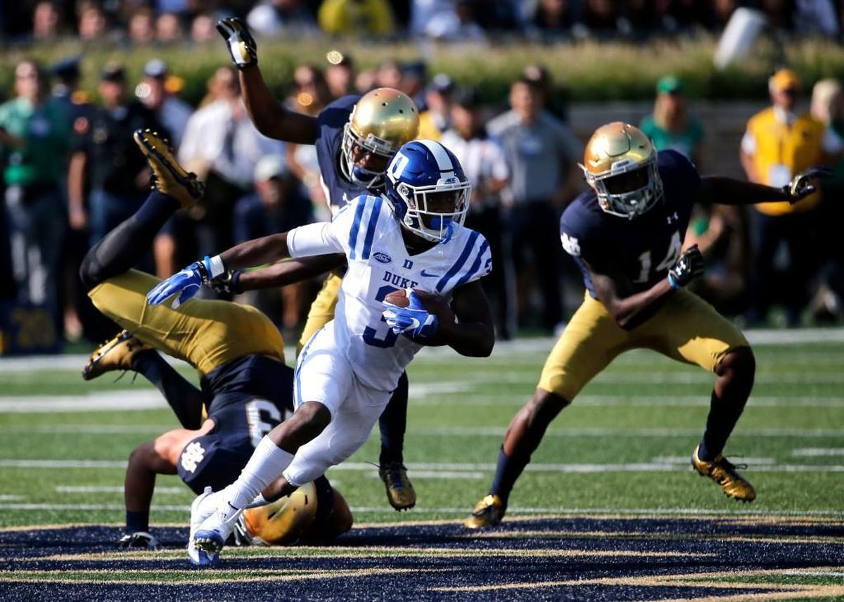 Duke wide receiver T.J. Rahming (3) heads down field past three Notre Dame defenders after catching a pass from quarterback Daniel Jones in September.