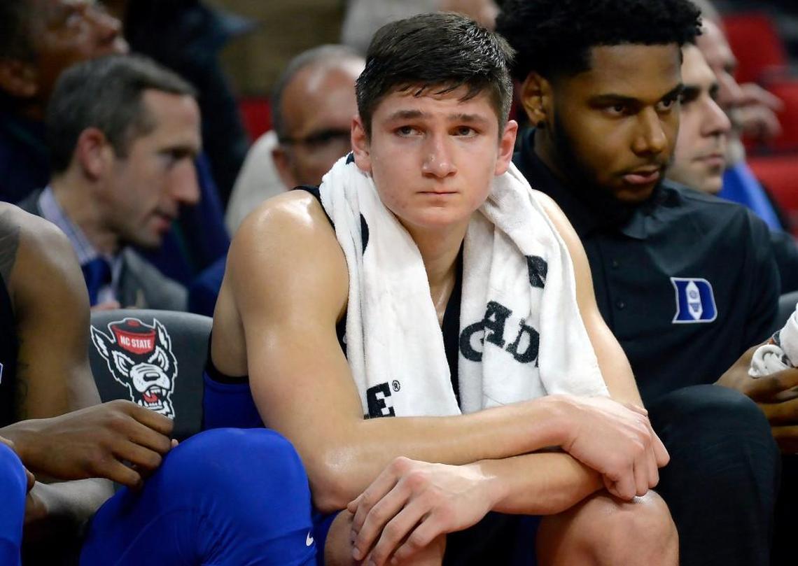 Duke guard Grayson Allen (3) sits on the bench in the closing seconds of the Blue Devils upset loss to N.C. State. Allen scored only eight points in the loss.
