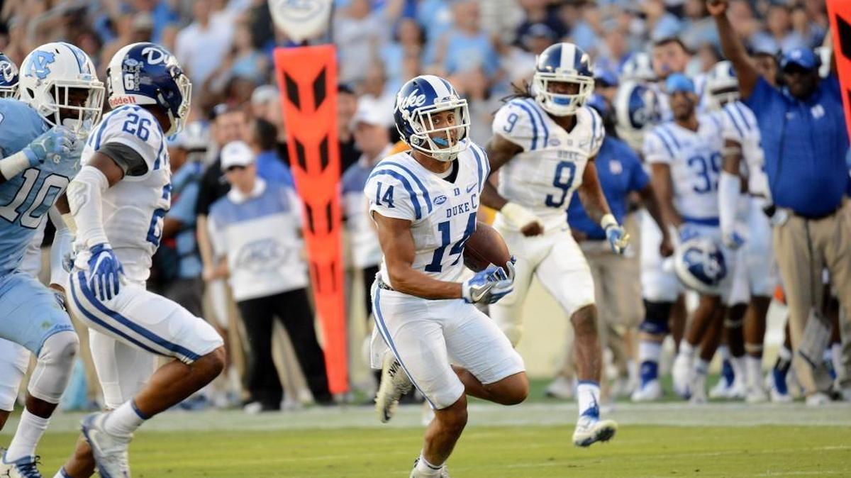 Duke's Bryon Fields returns an interception 61 yards for a touchdown against UNC in the fourth quarter.