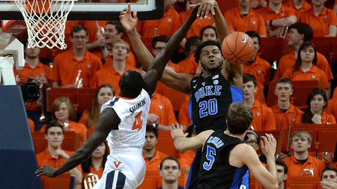 Duke center Marques Bolden (20) blocks a shot in the Blue Devils game against Virginia on Feb. 15. Bolden is suffering from flu-like symptoms.