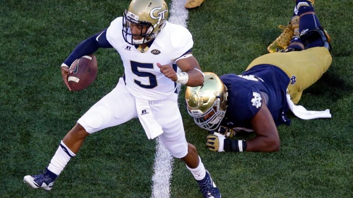 
Georgia Tech quarterback Justin Thomas (5) gets past Notre Dame defensive lineman Isaac Rochell during the second half of an NCAA college football game in South Bend, Ind., Saturday, Sept. 19, 2015. Notre Dame defeated Georgia Tech 30-22. (AP Photo/Michael Conroy)
