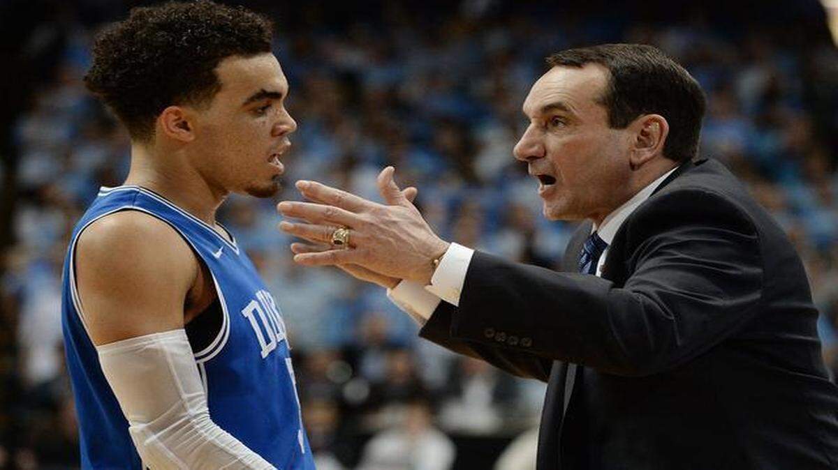 
Duke guard Tyus Jones (5) and head coach Mike Krzyzewski talk during the second half of play as UNC leads. Duke defeated UNC 84-77 at the Dean Smith Center in Chapel Hill, NC Saturday, March 7, 2015 in the final game of the regular season.
