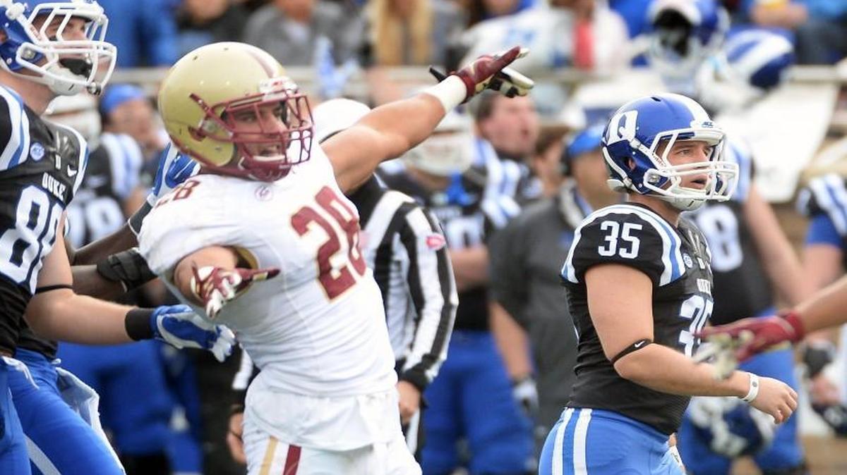 
Boston College linebacker Matt Milano (28) signals “no good” as Duke place kicker Ross Martin (35) watches his kick go through the uprights for his third field goal.
