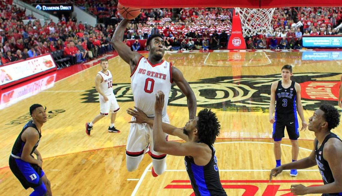 N.C. State's Abdul-Malik Abu (0) slams in two as Duke's Marvin Bagley III (35) attempts to defend.