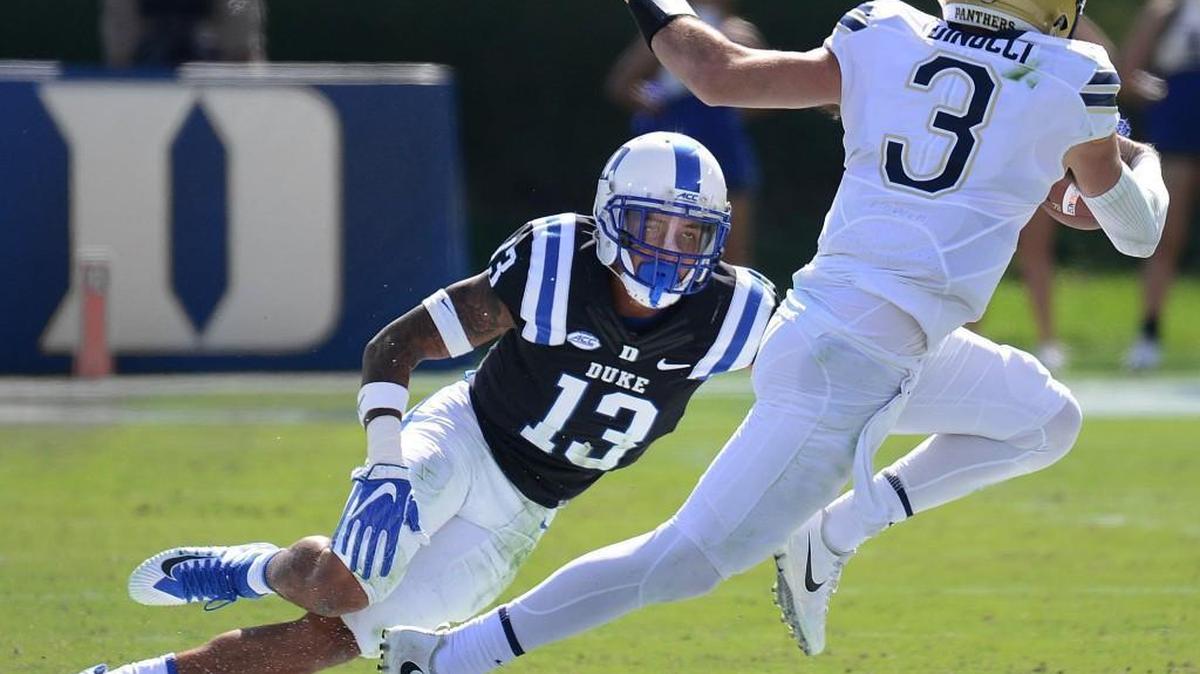 Duke's Jordan Hayes (13) goes after Pittsburgh quarterback Ben DiNucci (3) during their ACC football game Saturday, October 21, 2017, in Wallace Wade Stadium.