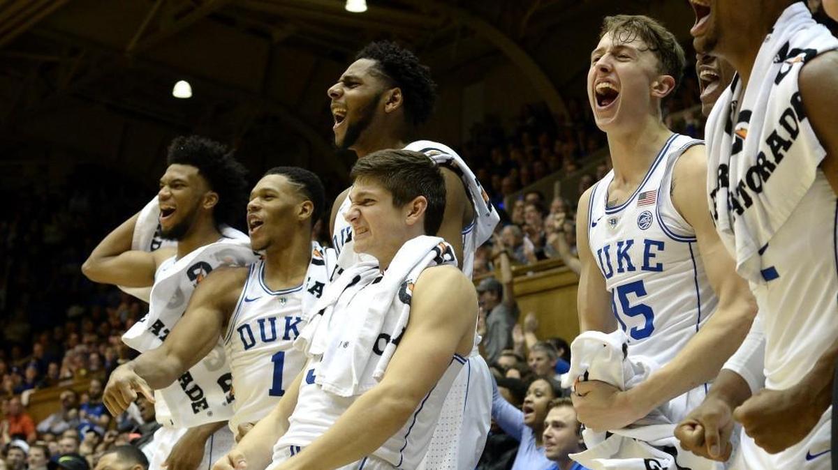 Duke basketball players, left to right, Marvin Bagley III, Trevon Duval, Marques Bolden, Grayson Allen and Alex O’Connell, react as freshman walk-on Mike Buckmire scores against Saint Francis on Dec. 5.