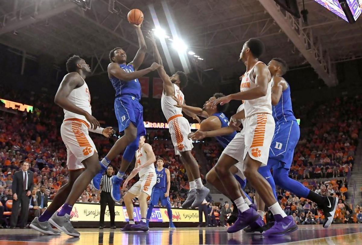 Duke forward Wendell Carter Jr (34) goes up to score in the second half of play as Clemson guard Gabe DeVoe (10) defends. Duke defeated Clemson 66-57.