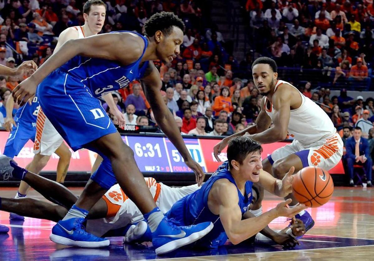 Duke guard Grayson Allen (3) passes a loose ball he snagged after a second half floor scramble as Duke defeated Clemson 66-57.