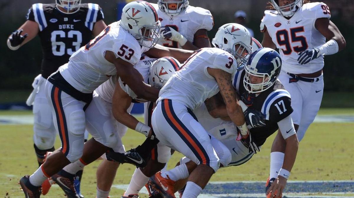 Duke quarterback Daniel Jones (17) is tackled by Virginia's Quin Blanding (3) in the second quarter at Wallace Wade Stadium Saturday.