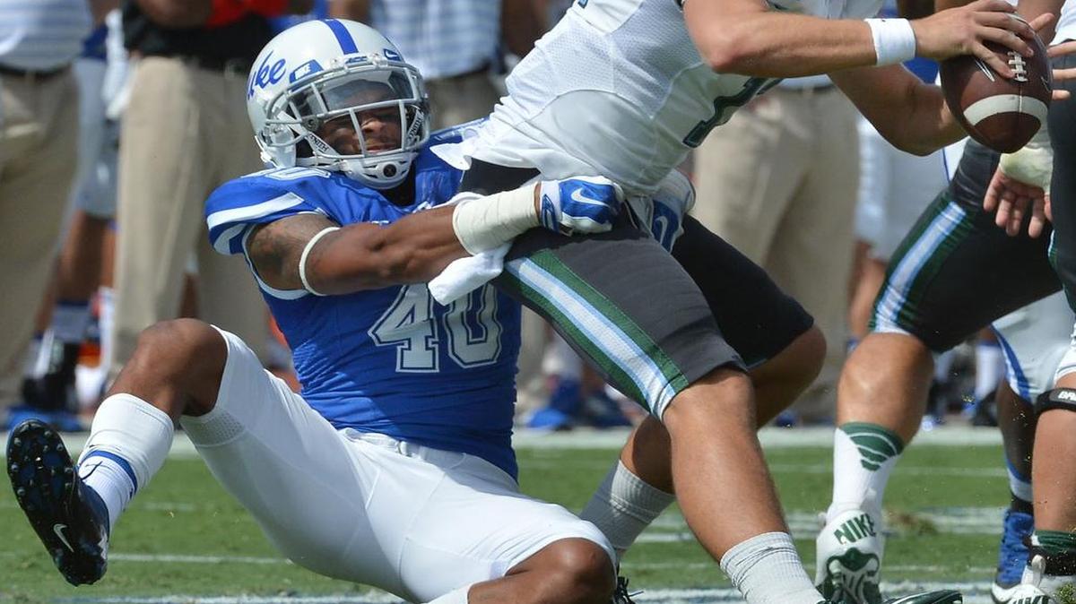 
Duke safety Dwayne Norman (40) sacks Tulane quarterback Tanner Lee (12) in the second quarter of play at Wallace Wade Stadium in Durham, N.C. Saturday, Sept. 20, 2014.
