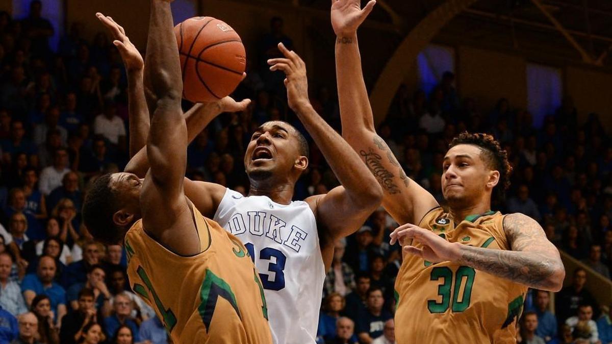 Duke guard Matt Jones, middle, gets tangles up with Notre Dame guard Demetrius Jackson, left, and forward Zach Auguste, right, on Jan. 16 during the Blue Devils’ 95-91 loss to the Irish.