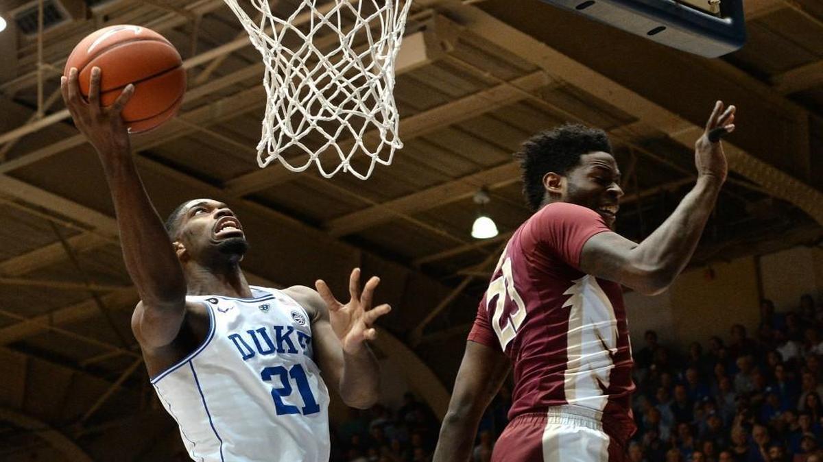 Duke’s Amile Jefferson scores a first-half basket over Florida State’s Christ Koumadje at Cameron Indoor Stadium.