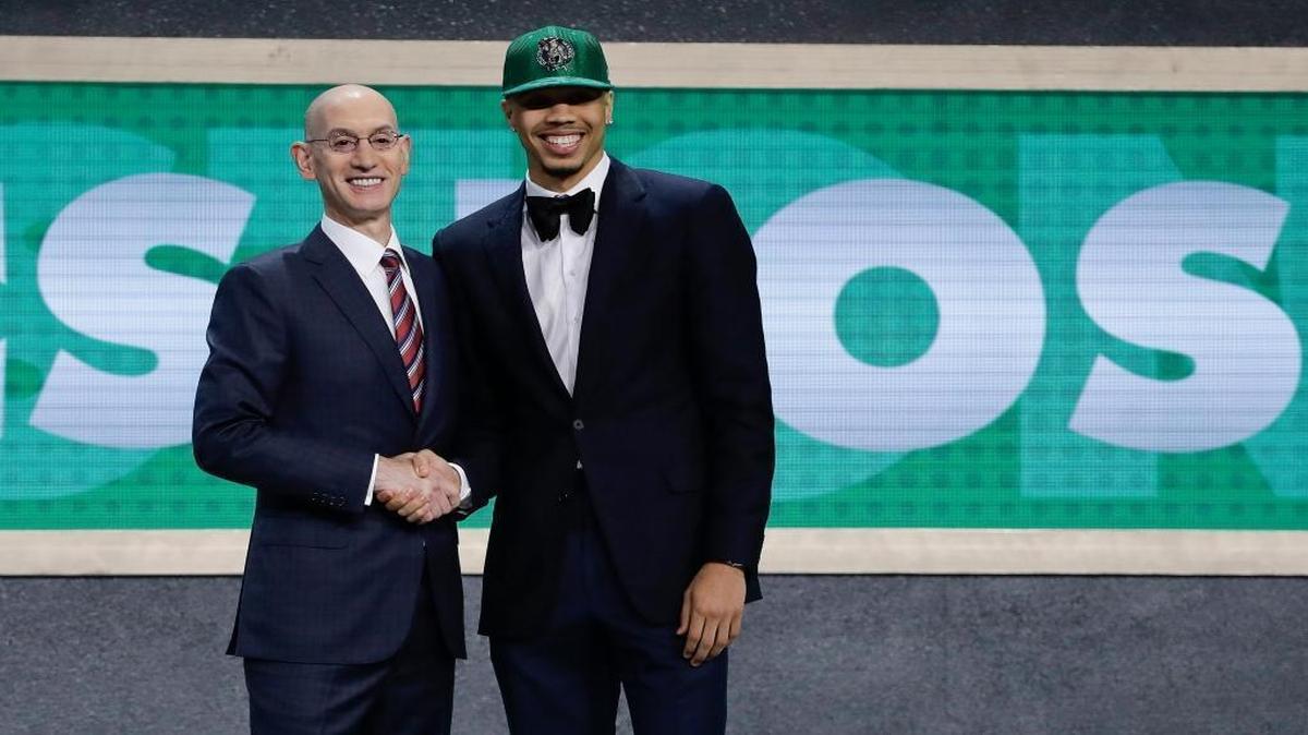 Duke's Jayson Tatum, right, poses for photos with NBA Commissioner Adam Silver after being selected by the Boston Celtics as the No. 3 pick overall during the NBA basketball draft, Thursday, June 22, 2017, in New York.