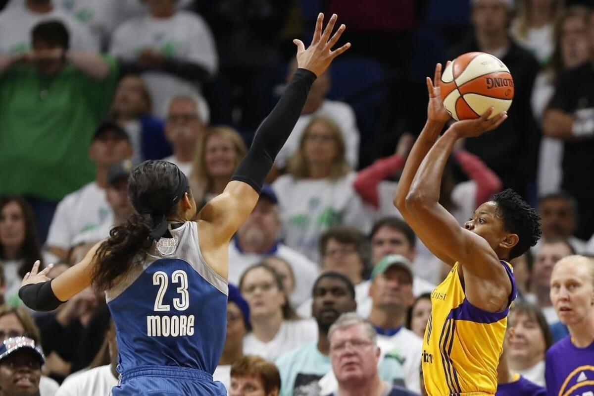 Los Angeles Sparks guard Alana Beard, right, lines up the game winning shot against Minnesota Lynx forward Maya Moore in Game 1 of the WNBA finals in 2016.