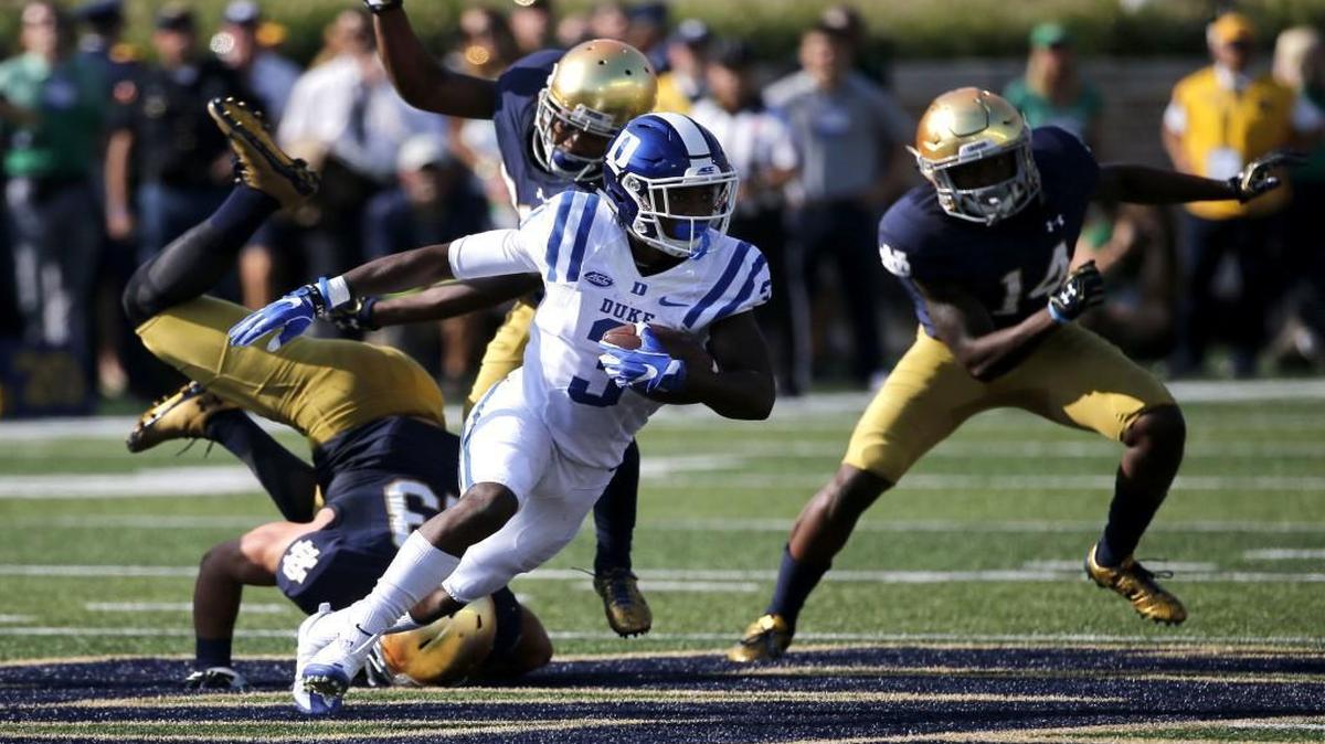 Duke wide receiver T.J. Rahming (3) heads downfield past three Notre Dame defenders after catching a pass from quarterback Daniel Jones during the first half in South Bend, Ind.