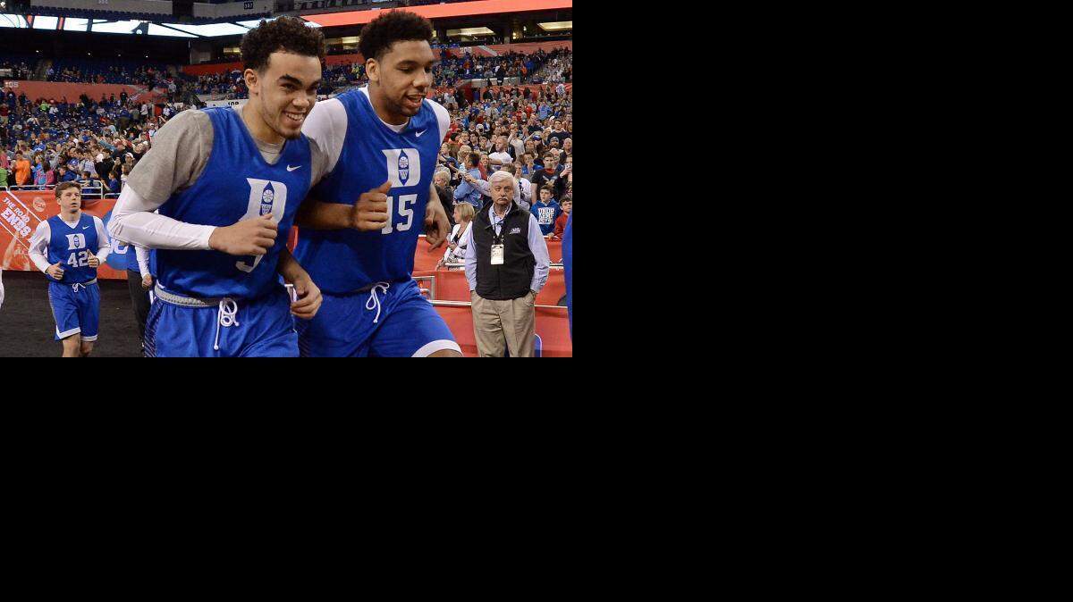 
Tyus Jones, lewft, and Jahlil Okafor decided in the ninth grade they would play college basketball together. They picked Duke because they believed they could win it all with the Blue Devils.
