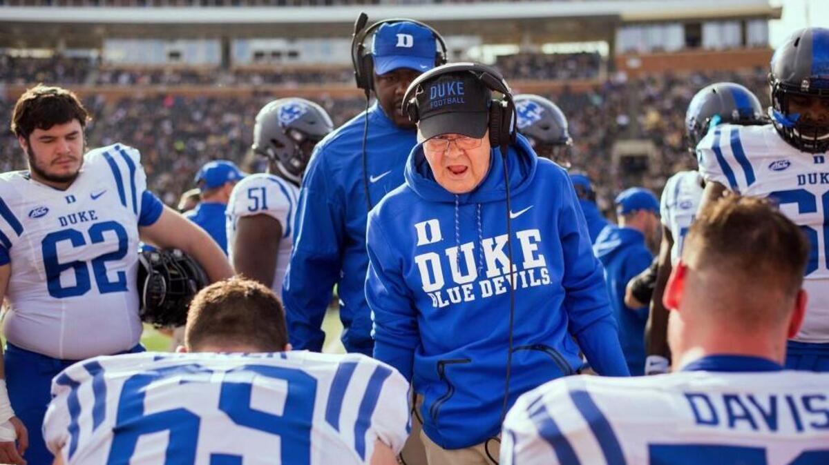 Duke head coach David Cutcliffe speaks to players on the sideline after a touchdown in the second quarter against Wake Forest, on Nov. 25, 2017, at BB&T Field in Winston-Salem, N.C. (Allison Lee Isley/The Winston-Salem Journal via AP)