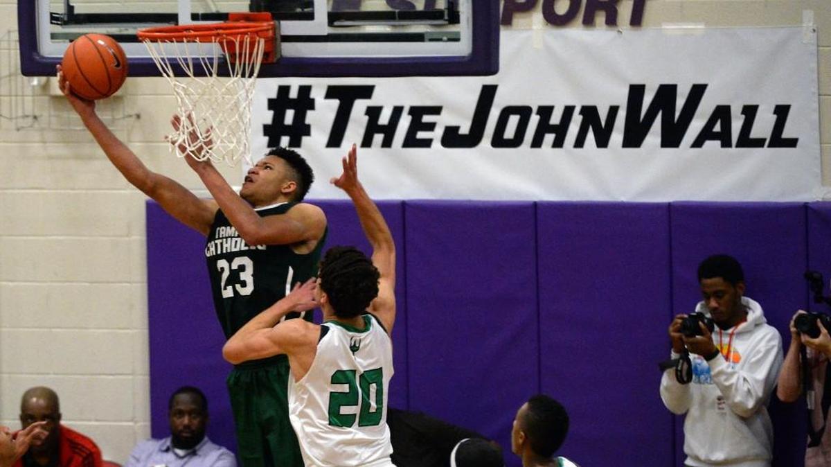 Kevin Knox (23), of Tampa Catholic goes up for a reverse lay-up against Cary on Dec. 27. Knox is expected to make his college decision in April.