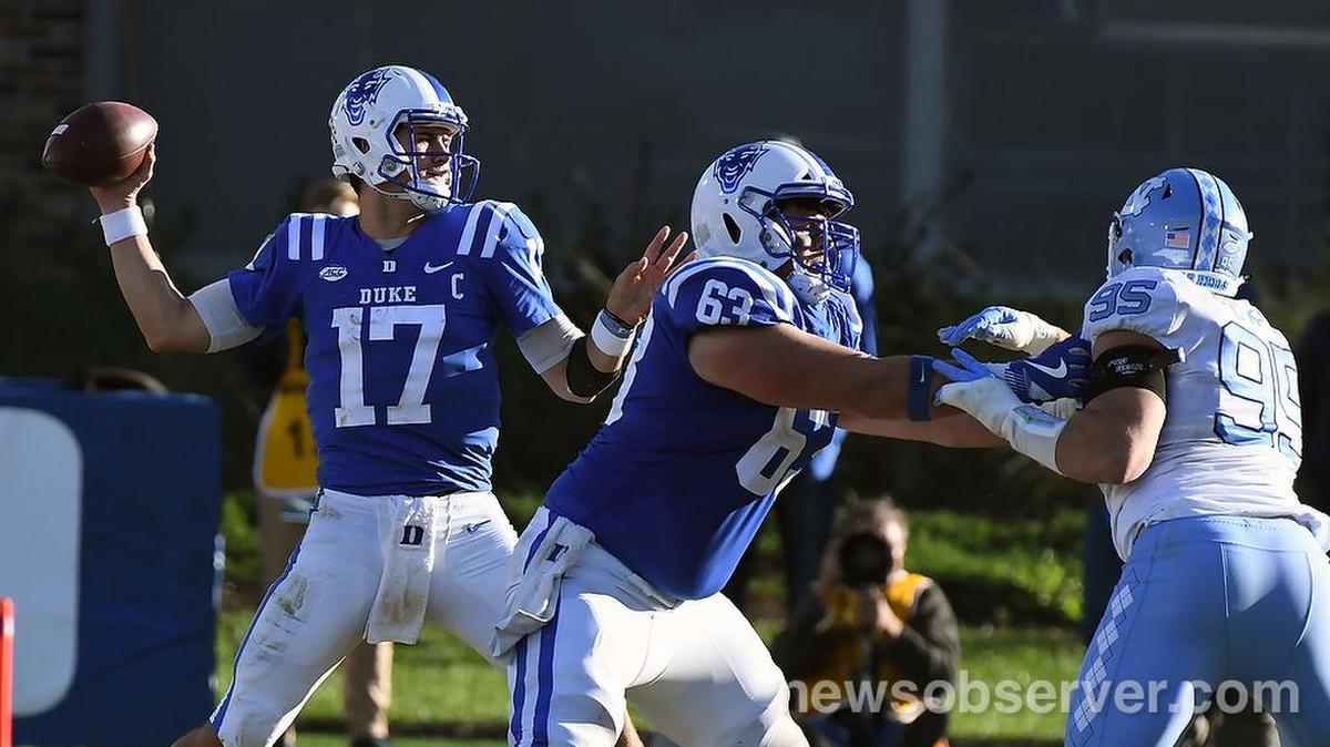 Duke quarterback Daniel Jones (17) rears back to throw a fourth quarter pass as guard Zach Harmon (63) blocks on the play. Duke defeated UNC 42-35 at Wallace Wade Stadium In Durham, N.C., Saturday, Nov. 10, 2018. Jones threw for 361 yards against the Tar Heels.
