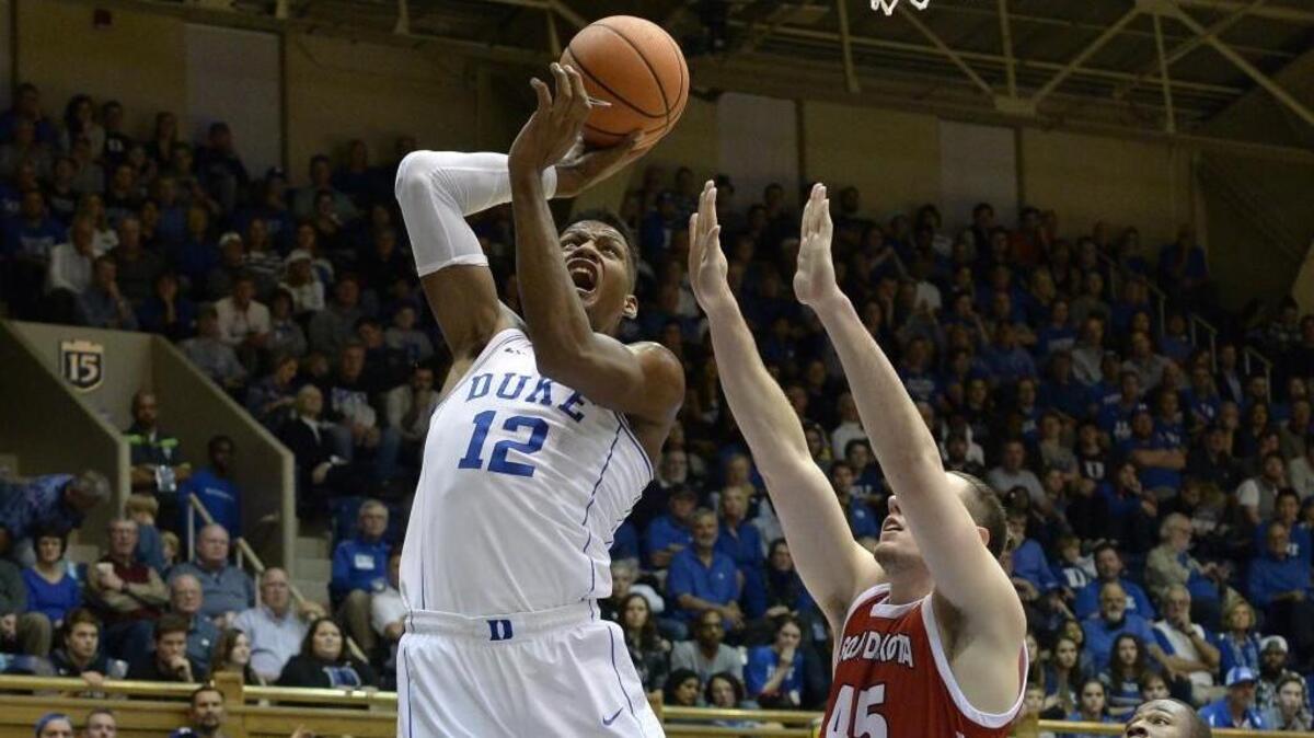 Duke forward Javin DeLaurier (12) shoots over South Dakota forward Austin Sparks (45) in the second half of play. Duke defeated South Dakota 96-80 at Cameron Indoor Stadium in Durham, N.C. Saturday December 2, 2017.