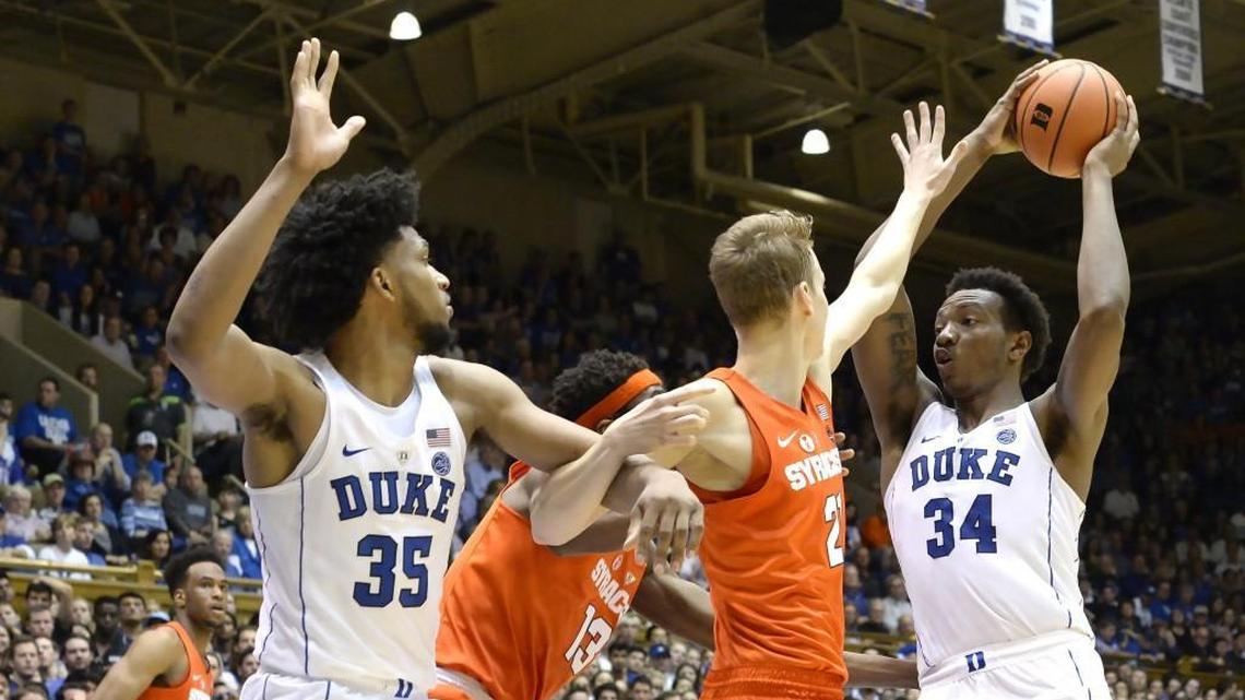 Duke forward Wendell Carter Jr (34) looks to make a second half pass to teammate forward Marvin Bagley III (35) over the Syracuse defense. Duke defeated Syracuse 60-44 at Cameron Indoor Stadium In Durham, N.C. Saturday, Feb. 24, 2018.