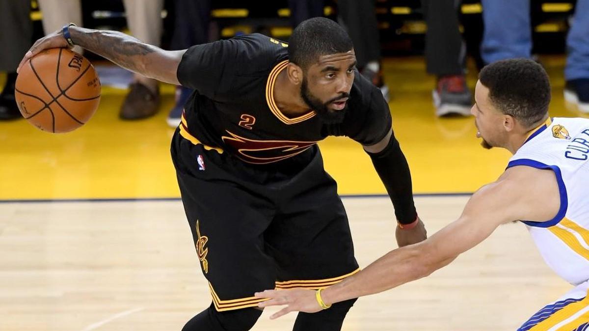 Cleveland’s Kyrie Irving drives against Golden State’s Stephen Curry in Game 7 of the 2016 NBA Finals on June 19. Irving, a former Duke player, joins Blue Devils coach Mike Zrzyzewski on the US Olympics basketball team.