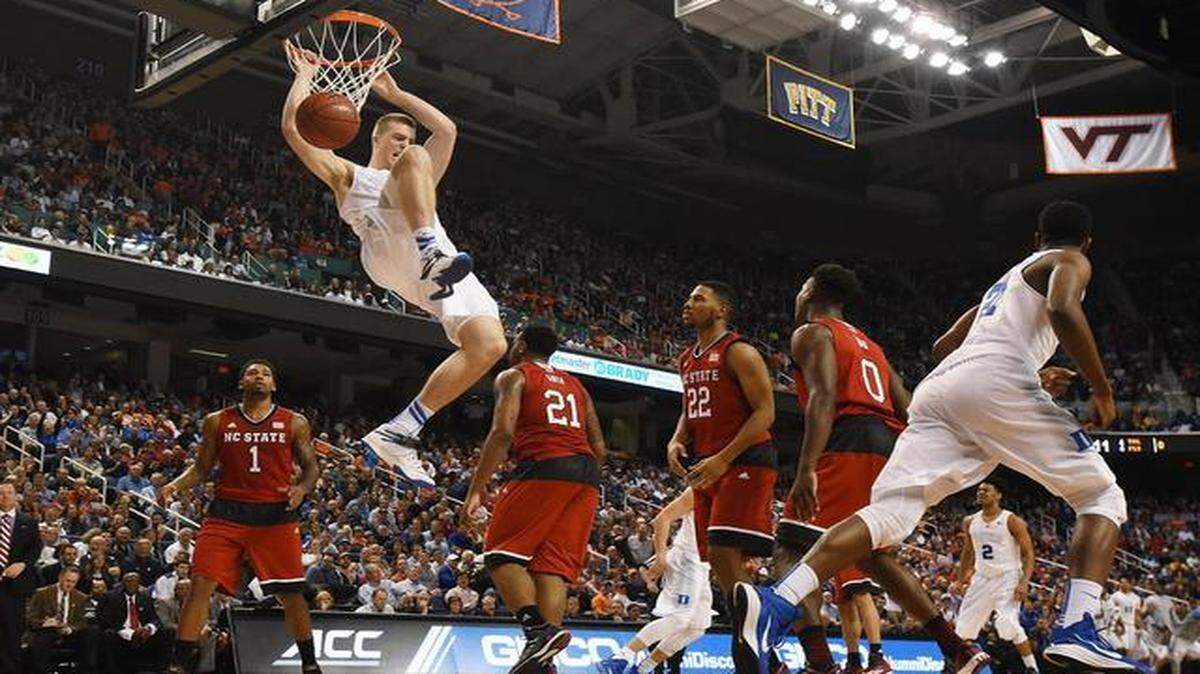 
Duke center Marshall Plumlee (40) jams home a dunk in the first half of play over the N.C. State defense in the first half at the semi-final round of the Atlantic Coast Conference basketball tournament.
