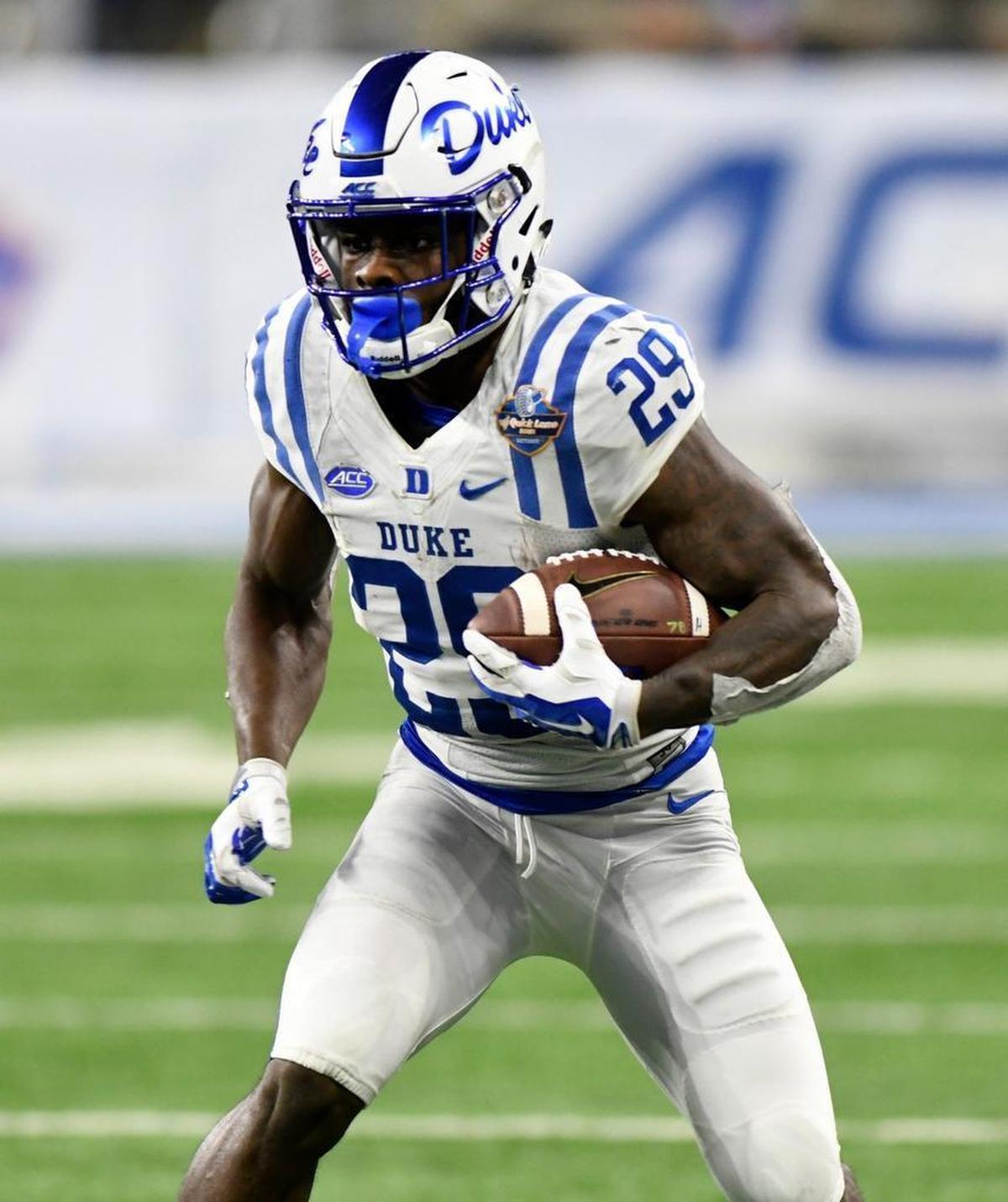 Duke running back Shaun Wilson (29) runs against Northern Illinois during the second quarter of the Quick Lane Bowl NCAA college football game, Tuesday, Dec. 26, 2017, in Detroit.
