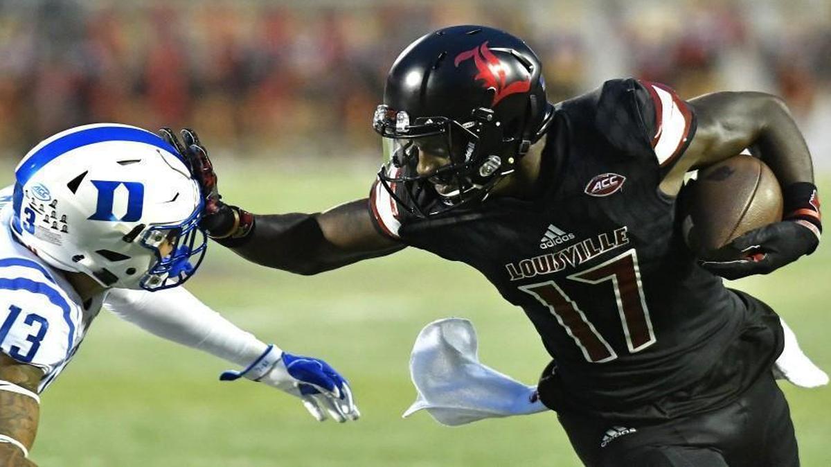Louisville's James Quick (17) pushes off a tackle by Duke's Jordan Hayes (13) during the first half in Louisville, Ky.