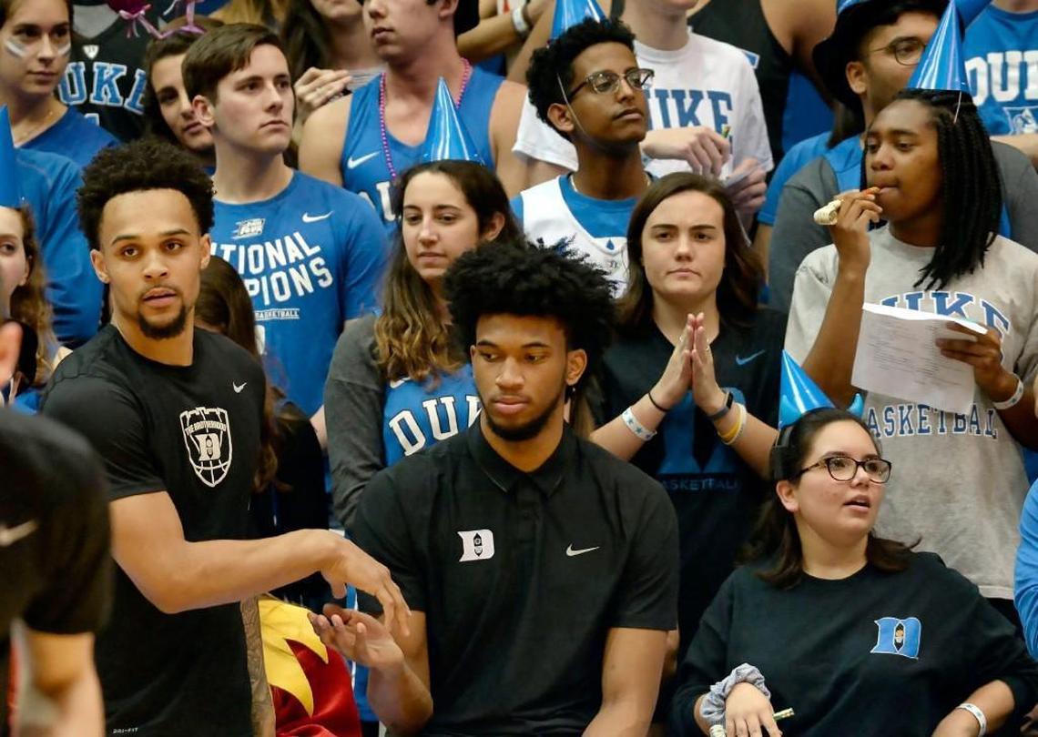 Duke guard Gary Trent Jr. (left) slaps hands with Duke forward Marvin Bagley III (35) as he watches the team warm up before the Virginia Tech game at Cameron Indoor Stadium. Bagley missed his second game in a row due to a sprained knee.