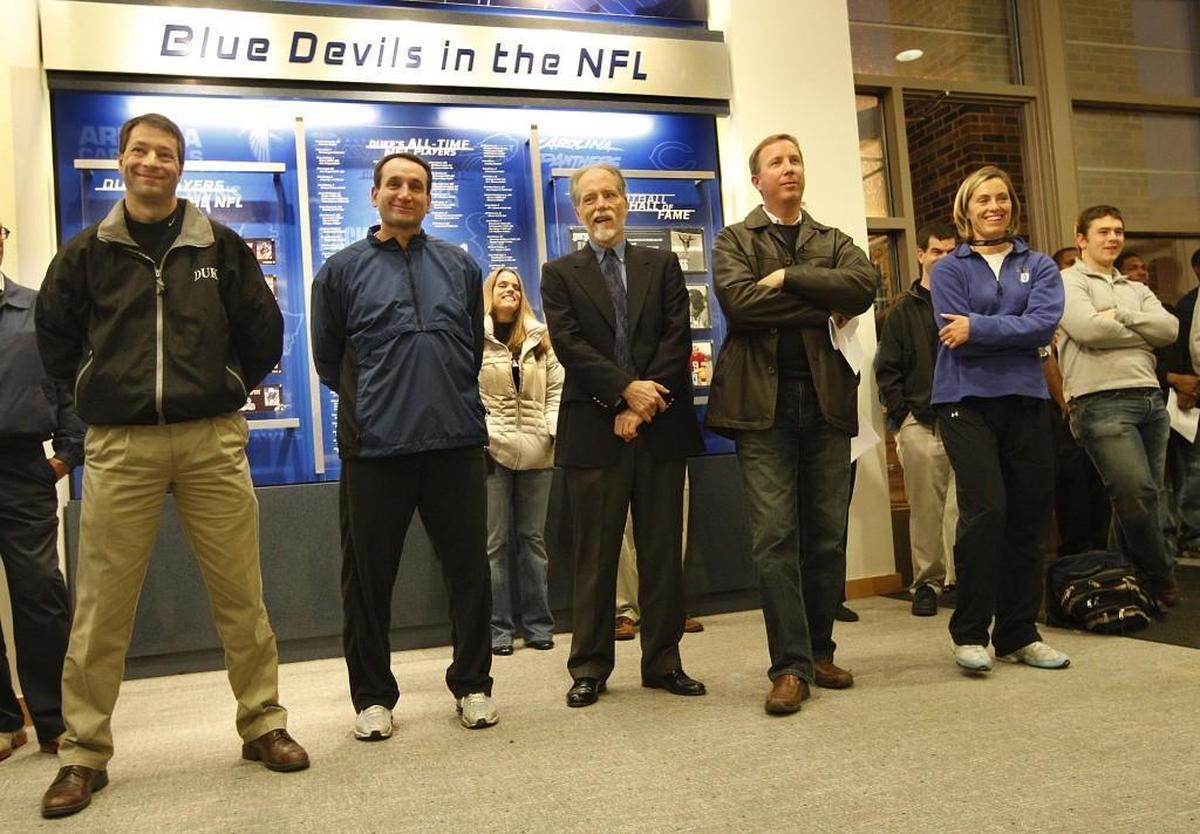Duke head basketball coach Mike Krzyzewski, second from left, laughs as newly appointed football coach David Cutcliffe makes a joke about trying out for the basketball team on Dec. 15, 2007.
