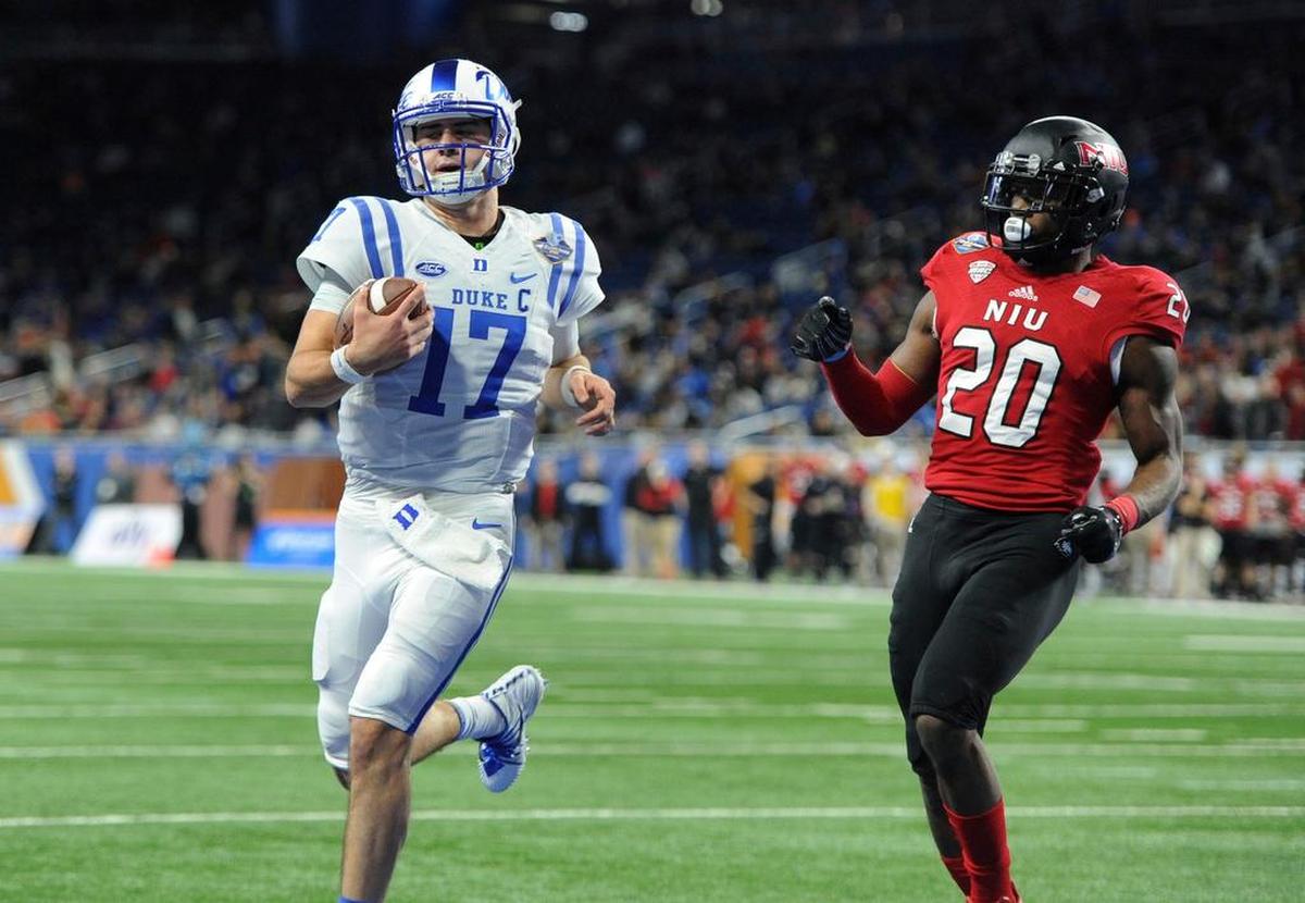 Duke quarterback Daniel Jones (17) runs for a touchdown past Northern Illinois safety Mycial Allen (20) during the first quarter of the Quick Lane Bowl NCAA college football game, Tuesday, Dec. 26, 2017, in Detroit.