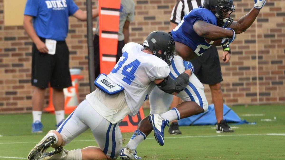 Duke linebacker Ben Humphreys tackles Jela Duncan during an intra-squad scrimmage on Aug. 19. Humphreys does Duke’s playcalling on defense.