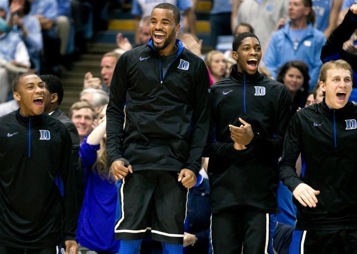 MARCH 9, 2013 Duke 69, UNC 53 Duke’s Josh Hairston, center, cheers from the bench in in the Blue Devils win in Chapel Hill. Duke scored the first 14 points of the game and the Tar Heels trailed by 19 points and hadn’t made a 3-pointer with 7 minutes and 42 seconds left to play.