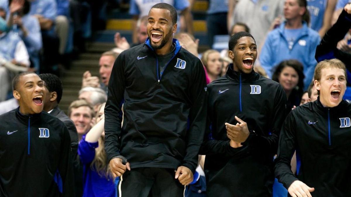 MARCH 9, 2013 Duke 69, UNC 53 Duke’s Josh Hairston, center, cheers from the bench in in the Blue Devils win in Chapel Hill. Duke scored the first 14 points of the game and the Tar Heels trailed by 19 points and hadn’t made a 3-pointer with 7 minutes and 42 seconds left to play.