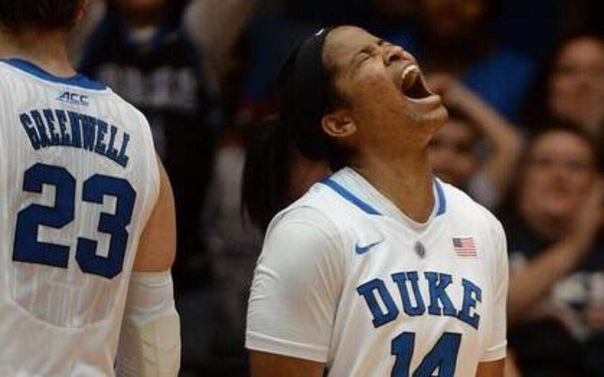 
Duke’s Ka'lia Johnson (14) reacts as the Blue Devils come from 11 points down in the second half against the Tar Heels at Cameron Indoor Stadium.
