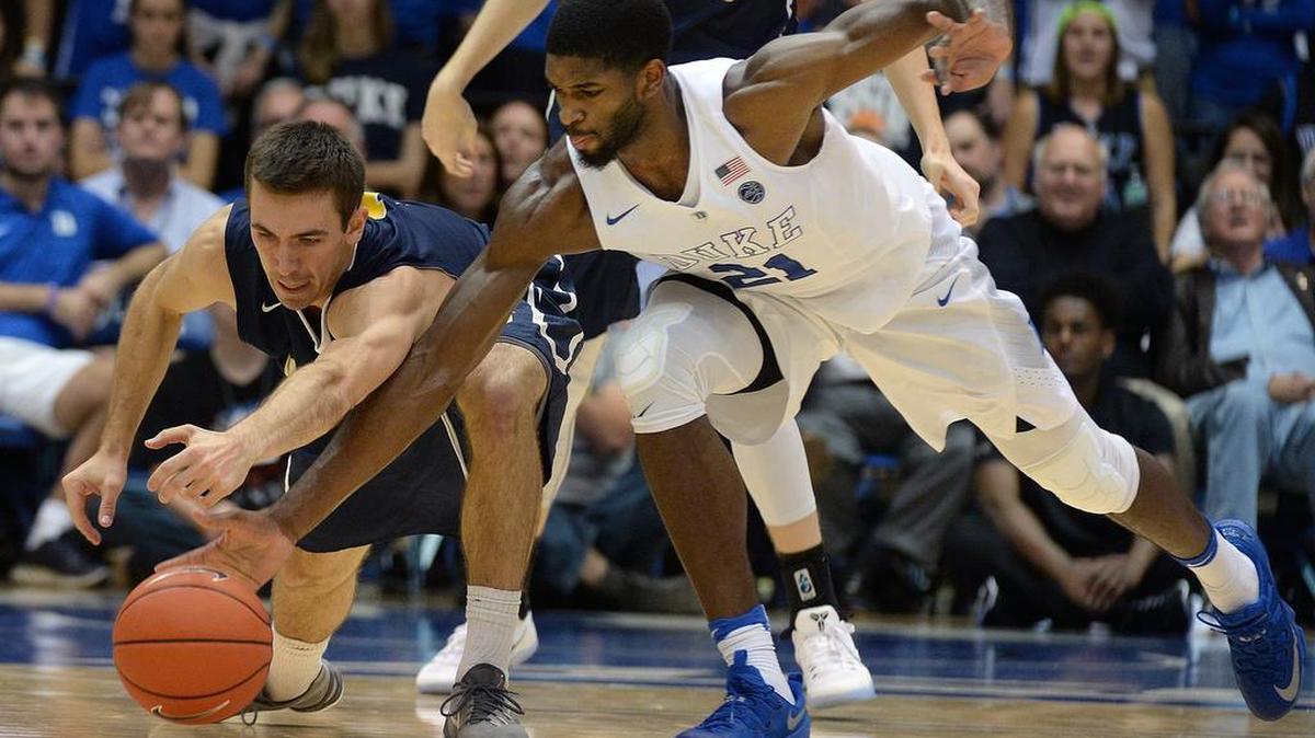 Duke's Amile Jefferson (21) dives for a loose ball with Augustana's Austin Saugstad (1) at Cameron Indoor Stadium, Nov. 4.