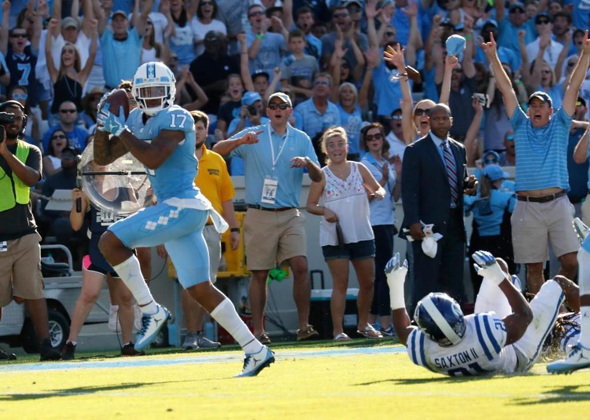 UNC's Anthony Ratliff-Williams (17) hauls in a TD pass against Duke's Alonzo Saxton II (21) during the second quarter.