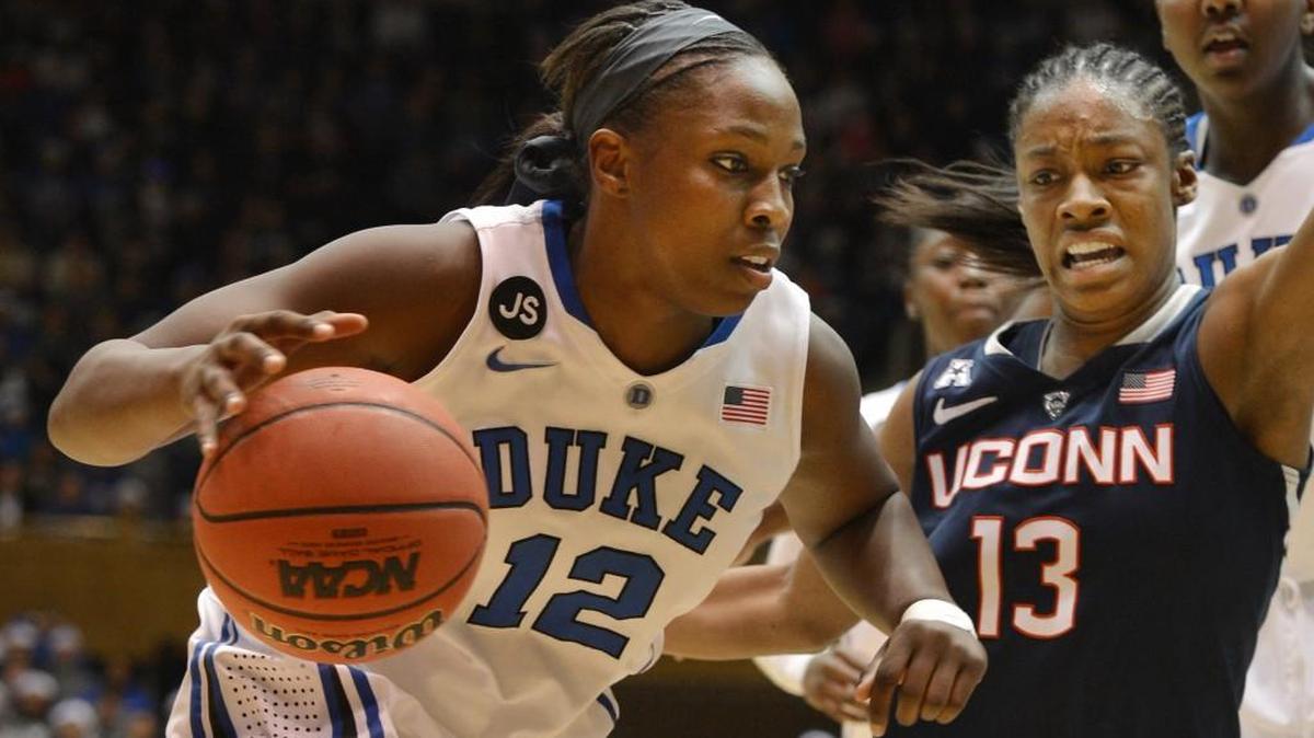 Duke guard Chelsea Gray (12) tries to get inside in the first half as Connecticut guard Brianna Banks (13) defends at Cameron Indoor Stadium on Dec. 17, 2013 in Durham.
