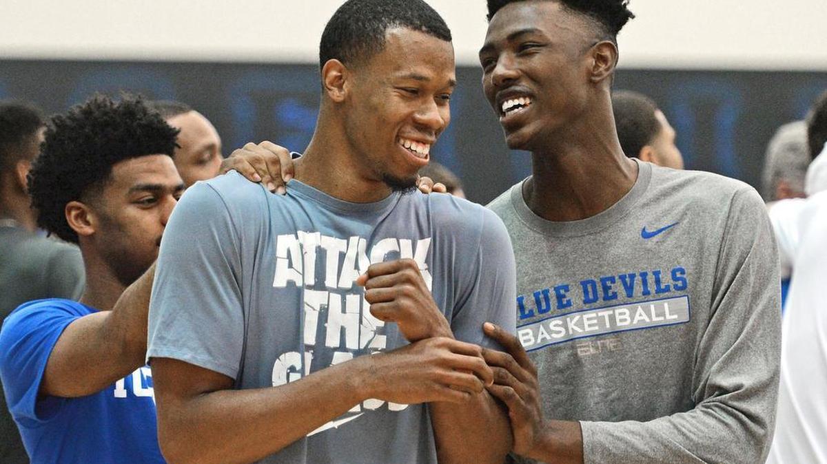 Duke recruit Harry Giles, right, clowns around with former Duke players Quinn Cook, left, and Rodney Hood during the Coach K Academy at the Duke basketball facility in Durham, N.C. Wednesday, June 1, 2016.