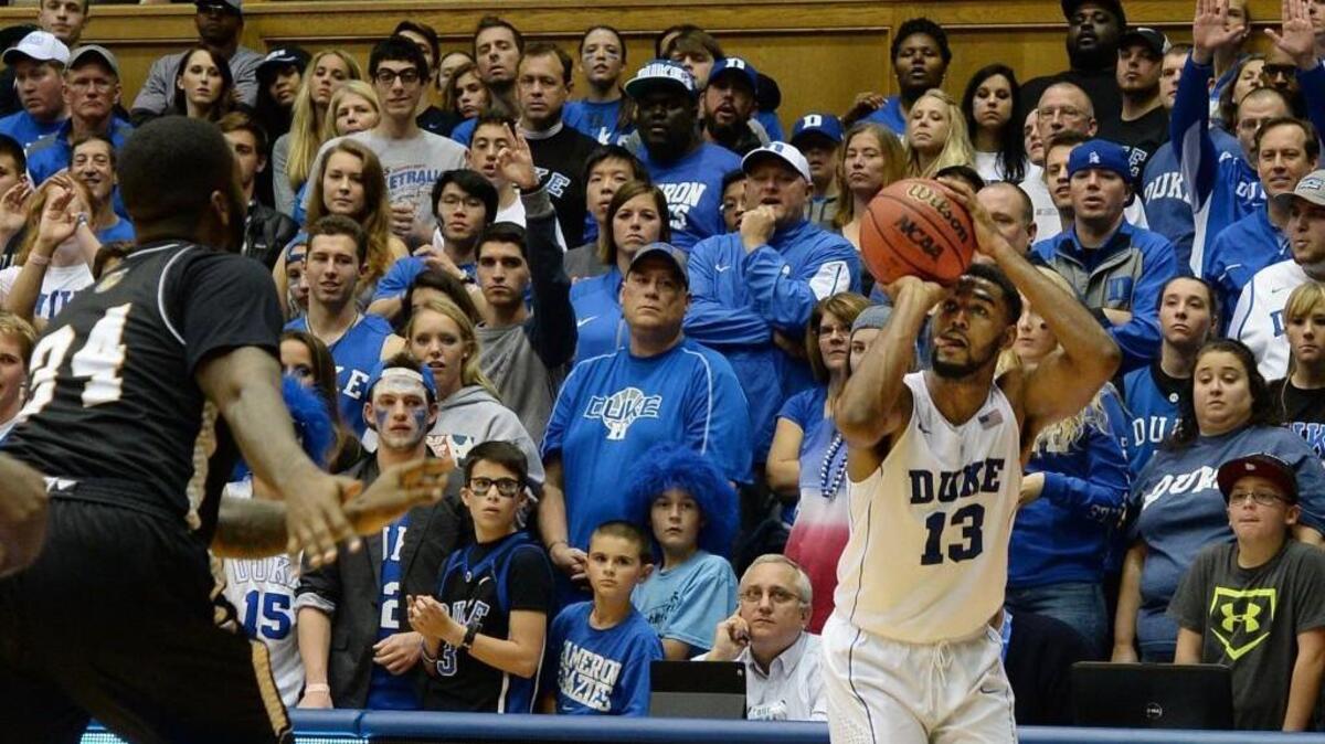 Duke guard Matt Jones goes up for one of his five first-half 3-pointers against Bryant at Cameron Indoor Stadium in Durham,.