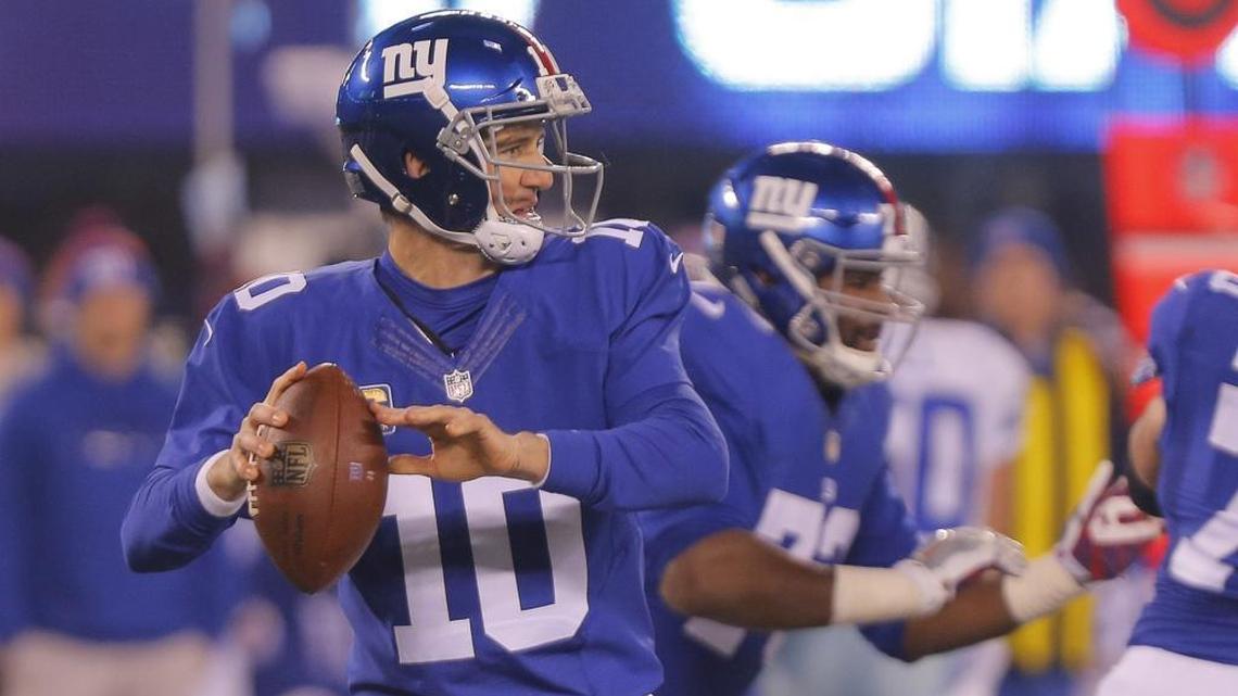 New York Giants quarterback Eli Manning (10) passes in the first quarter as the Dallas Cowboys play the New York Giants at MetLife Stadium in East Rutherford, New Jersey, last Dec.11. Manning and a few of his receivers will once again work out at Duke from April 3-6.