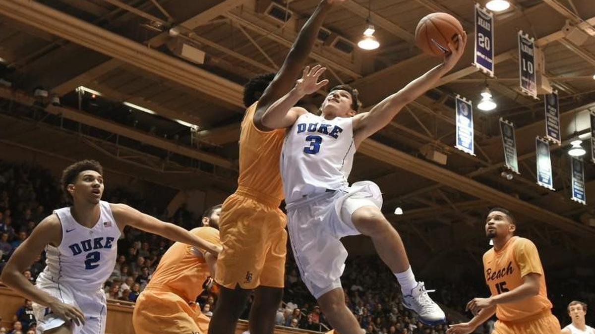 Duke’s Grayson Allen (3) goes in against Long Beach State’s A.J. Spencer (15) to score two of his 33 points against the 49'ers.