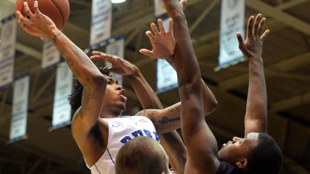 Duke forward Brandon Ingram (14) shoots over Mark Johnson (21) in the first half of play at Cameron Indoor Stadium, Wednesday, November 4, 2015.