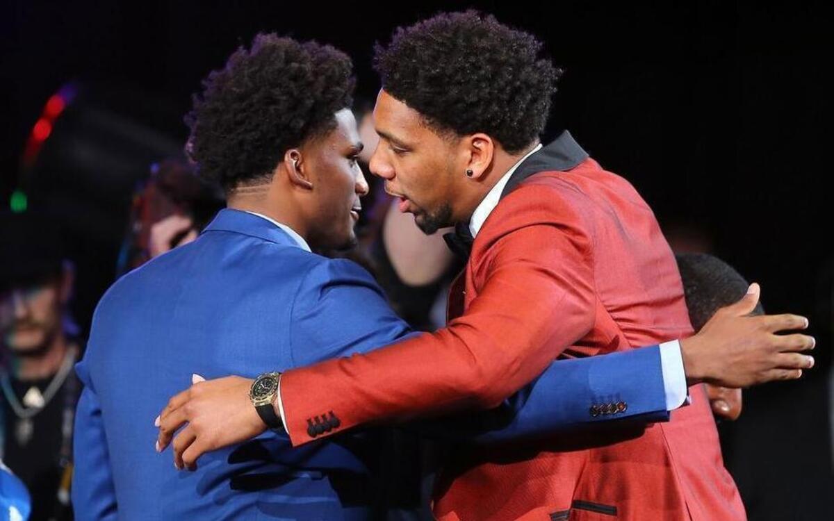 Jahlil Okafor, right, celebrates with Duke teammate Justise Winslow after being selected third overall Thursday night by the Philadelphia 76ers in the first round of the NBA draft. Winslow was selected seven picks later by Miami.