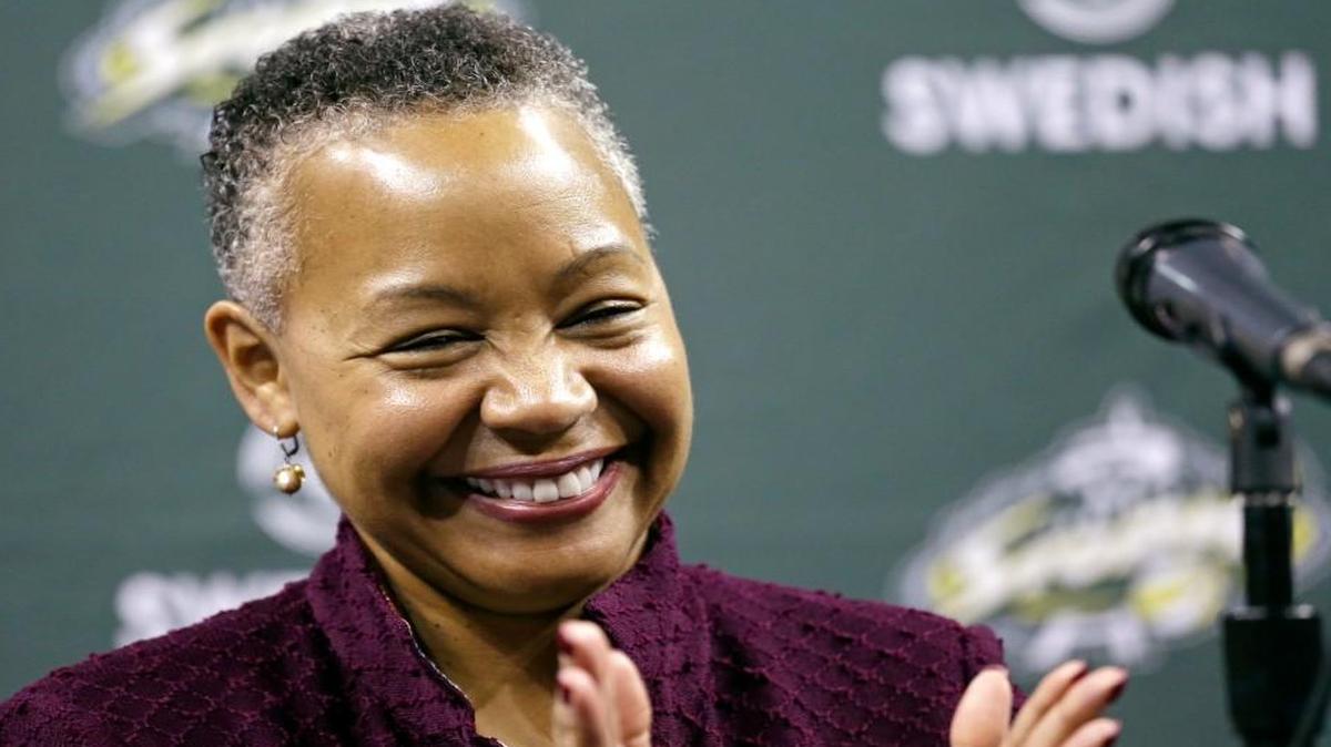 WNBA president Lisa Borders applauds at a Seattle Storm news conference on April 21, 2016, in Seattle. (AP Photo/Elaine Thompson)