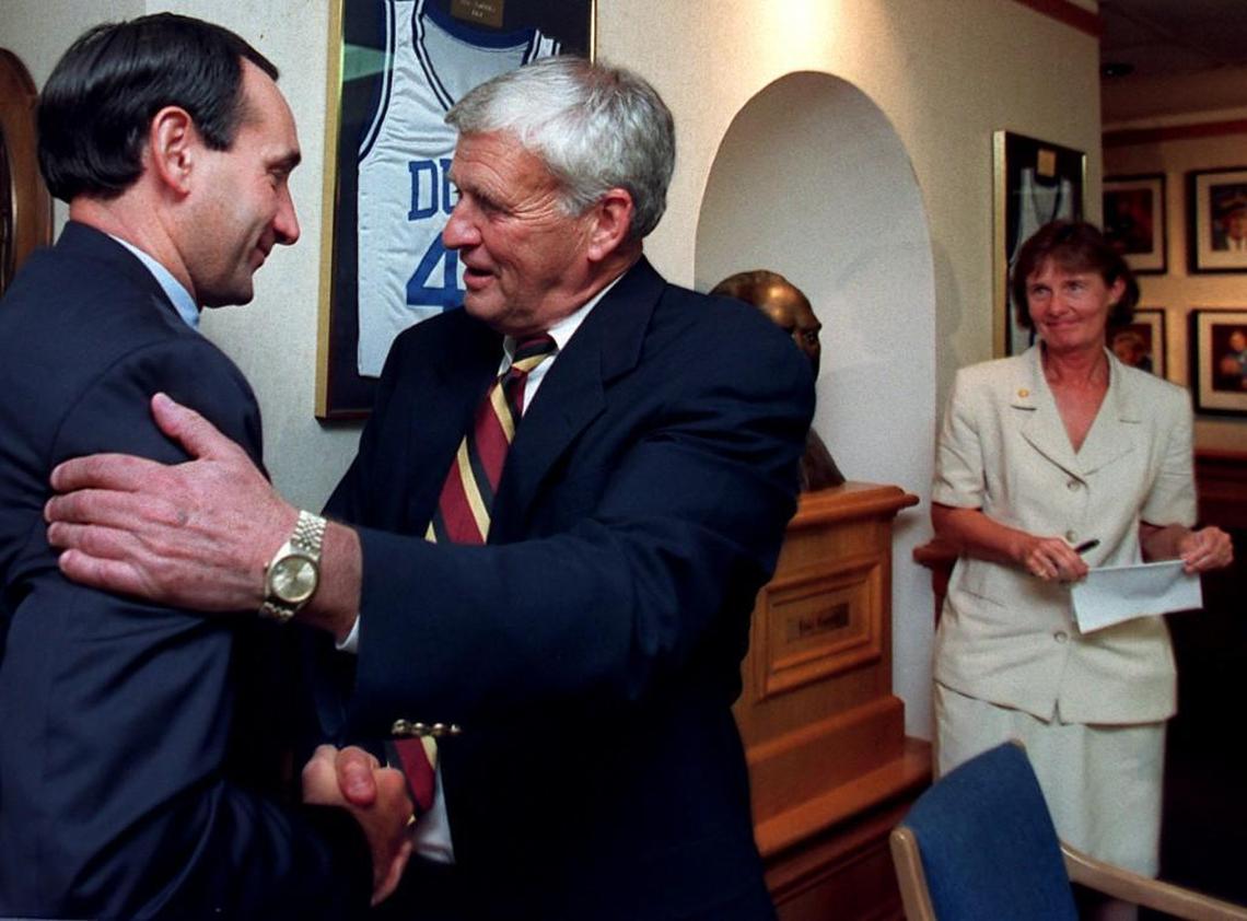 News & Observer file art: Duke basketball coach Mike Krzyzewski, left, congratulates athletic director Tom Butters after Butters announced his retirement in 1997. Butters passed away in 2016.