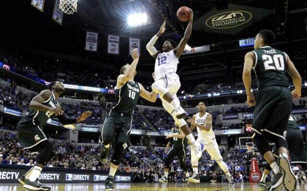 
Duke's Justise Winslow (12) puts up a shot during the second half of an NCAA college basketball game against the Michigan State, Tuesday, Nov. 18, 2014, in Indianapolis. Duke won 81-71. 
