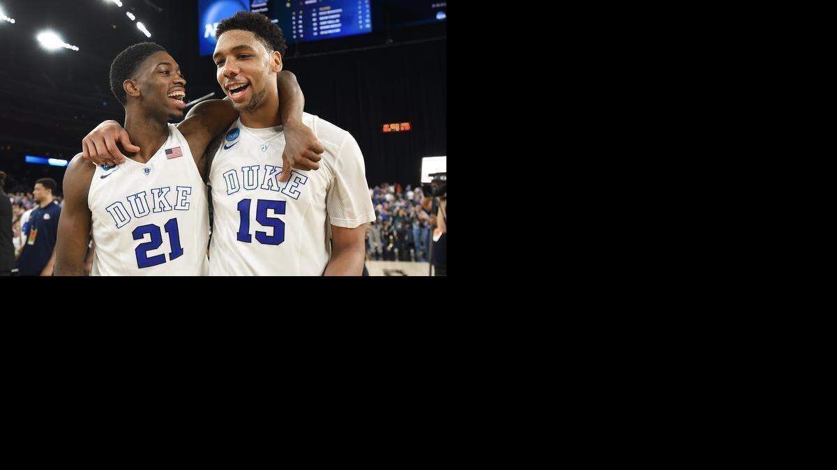 
Duke’s Amile Jefferson (21) and Jahlil Okafor are all smiles as they walk off the court after the Blue Devils beat Gonzaga 66-52 for the NCAA South Region championship and a berth in the Final Four.
